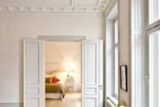 chic vintage ceiling molding plus trim and molding on the doors is a gorgeous way to add style to the space