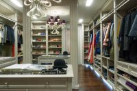 glazed cabinetry is the centerpiece of this extra large walk-in closet