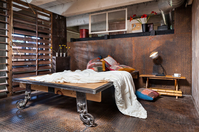 steel diamond plates make this room super unusual but a bed is still the centerpiece