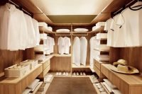 walk-in closet wardrobe in light wood tones