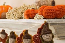 a crochet acorn and leaf garland will cozy up your space for the fall or Thanksgiving