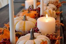 a fall wooden box with gourds, pumpkins, berries and candles is a lovely rustic piece for fall decor