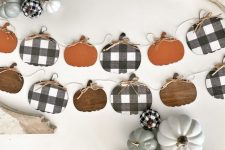 plywood pumpkin garlands in orange, plaid and stain are stylish to decorate your space for the fall and Thanksgiving