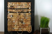 simple yet very orginal jewelry display made of a picture frame and wine corks