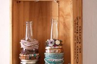 vintage crate could be hang on wall and your bracelts put on bottles standing in it