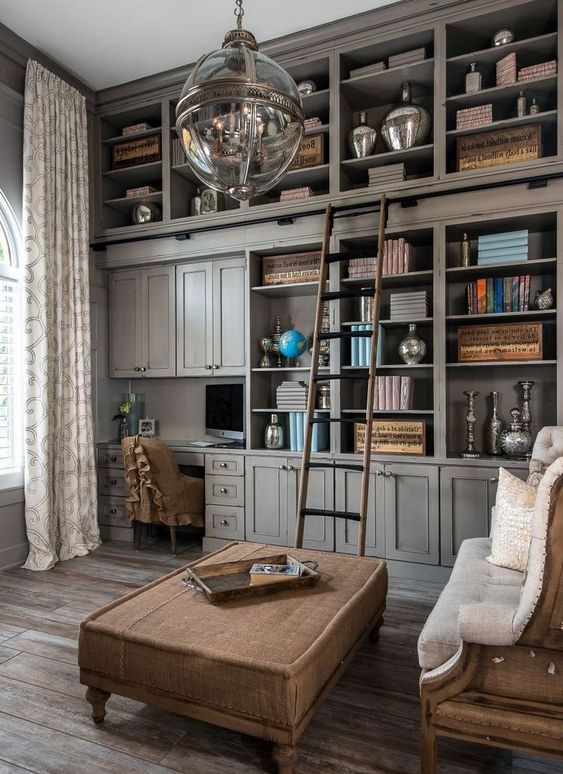 an oversized grey bookcase with closed and open storage compartments is an elegant and refined idea