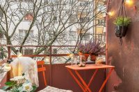 adding bright color to a balcony might help to make it more livable
