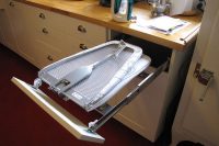 a fold-out ironing board in a spare drawer might become a perfect space saving solution for apartments