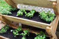 This cedar planter is a super cute way to grow herbs vertically! Great idea for a patio or deck.