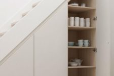 sleek hidden storage spaces with tableware are a great idea if you don’t have enough space in the kitchen
