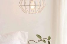 a catchy geometric wire pendant lamp with a bulb is a stylish idea for a contemporary bedroom