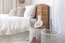 a wicker pendant lamp echoes with the same headboard and accessories make the bedroom feel more rustic