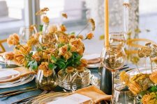 bright fall wedding centerpieces of buttermilk blooms and greenery with some dried elements, matching candles and napkins