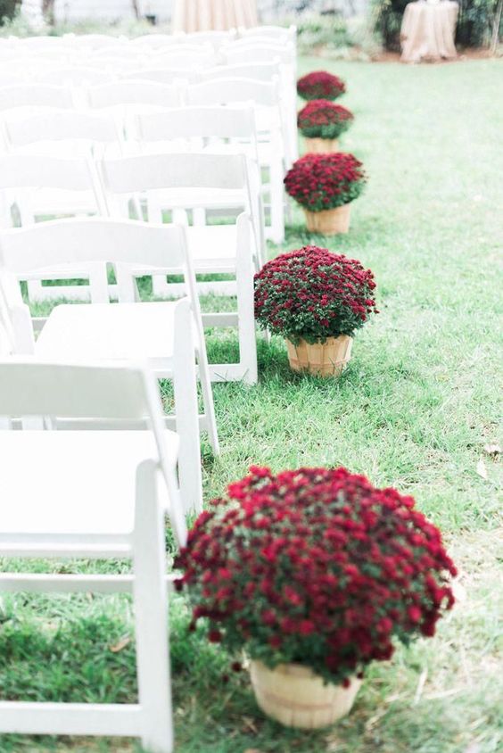 burgundy blooms in wooden baskets are amazing for lining up the aisle at a fall wedding ceremony