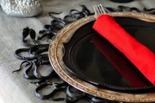 a black snake placemat will make your Halloween tablescape very spooky and special