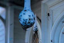a spider egg sac is a very stylish and very spooky Halloween decoration for both indoors and outdoors