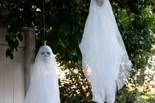 hanging ghosts with skulls are nice decorations for indoors and outdoors and can be made very fast