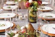 a wedding or party fall centerpiece in a vintage bowl with greenery, pears, apples and mushrooms is lovely and natural