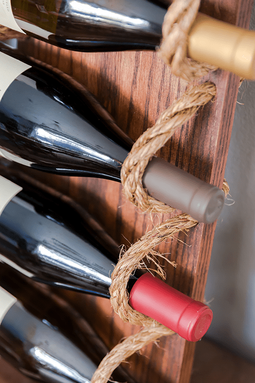 Picture Of chic diy rustic wine rack with rope  3