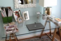 DIY sawhorse desk with a glass top