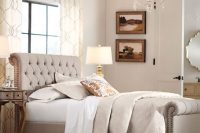 24 curved nailed tufted headboard
