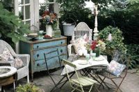 04 shabby chic courtyard with wooden furniture