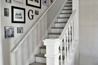 a mismatching black and white gallery wall with family photos, signs and monograms is a cool idea for a rustic space