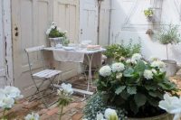 08 shabby whitewashed patio decorated with old doors