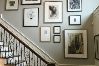 a refined free-form gallery wall with lots of graphic works of art and mismatching frames is a cool idea for a vintage or just sophisticated space