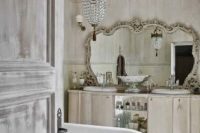 10 shabby chic bathroom with an oversized vintage mirror and a crystal chandelier