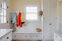 11 airy mudroom laundry with cabinetry