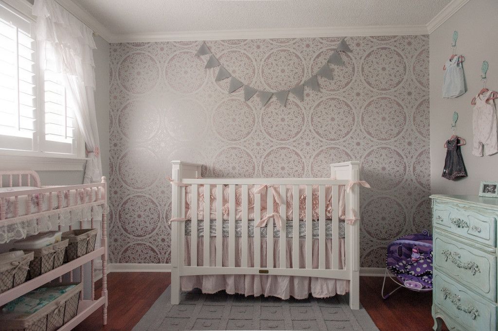 patterned wall behind the crib