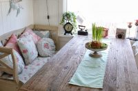 11 reclaimed wood table with a delicate table runner and a shabby bench with floral textiles