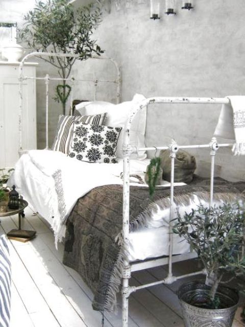 shabby whitewashed bed instead of a bench
