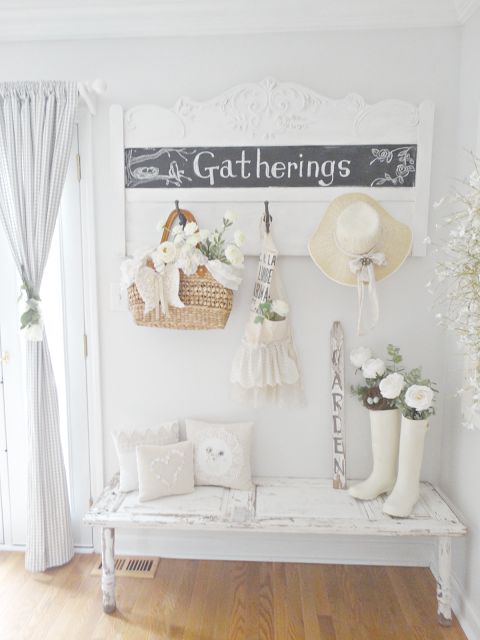 shabby chic whitewashed entryway with netural textiles and a chalkboard