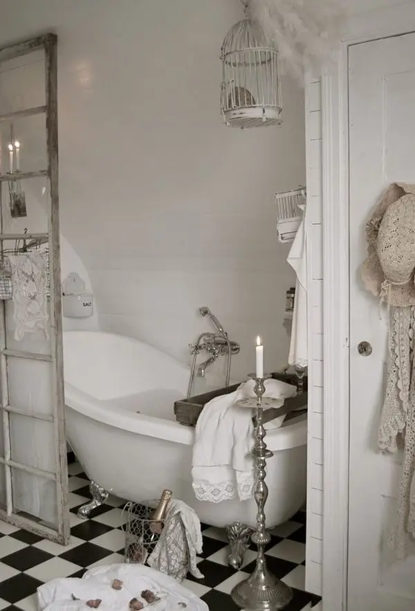 white shabby chic bathroom with a claw foot tub