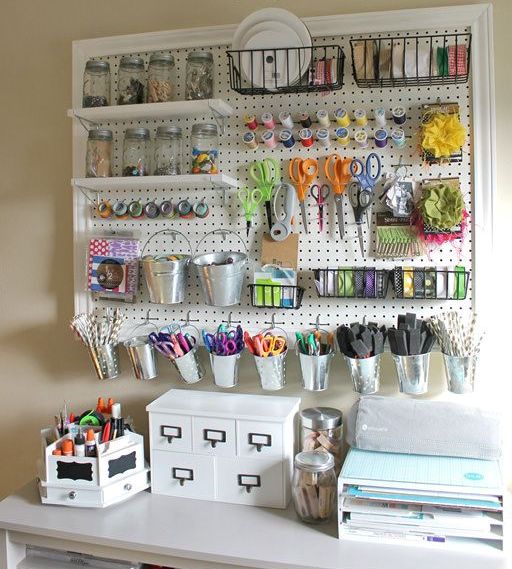 pegboard with shelves and buckets