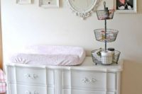 19 white vintage changing table with white framed gallery wall