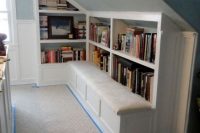 21 fitted attic bookshelves with seats