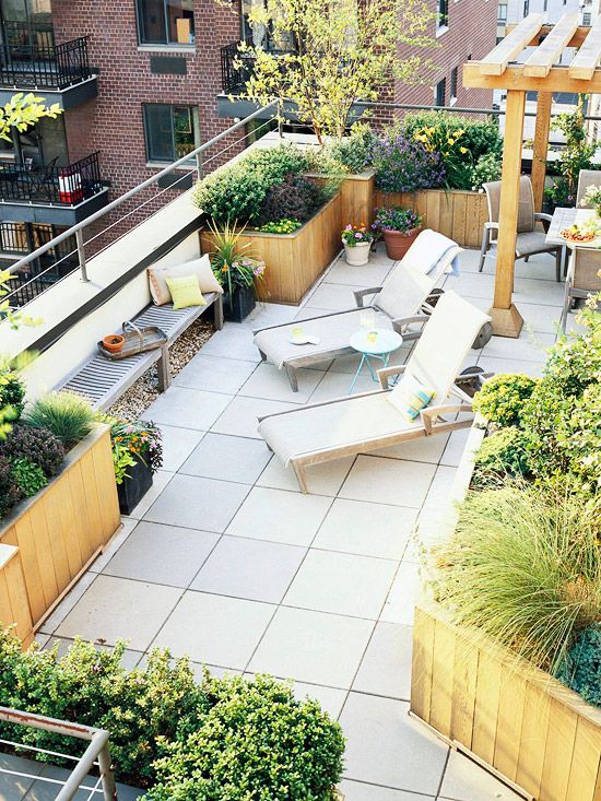 rooftop garden with wooden planters in rows