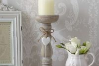 27 shabby candleholder and a milk jug used as a vase