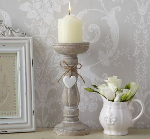 shabby candleholder and a milk jug used as a vase