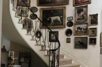 a gorgeous vintage-inspired gallery wall with artwork dedicated to dogs and vintage frames is a gorgeous idea
