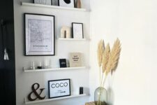 a cozy boho corner with ledges and artwork, some decor, a bench, baskets and pampas grass is lovely
