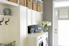 a shaker style cabinets are perfect to organize storage in a laundry room