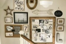 a large rustic gallery wall with family pics in frames, a memo board with photos and monograms, arrows and letters is cool