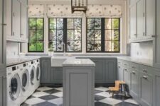 a gorgeous laundry room with kitchen cabinets