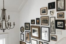 a refined and eclectic gallery wall of artwork in various frames, oval, round and others is a bold addition to the space