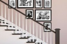 a stylish free-form gallery wall with black and white family pics and black frames adds a refined touch to the space