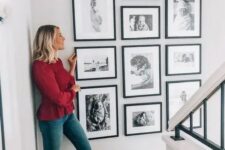 a stylish gallery wall with black and white ffamily pics in matching black frames is amazing and looks perfect